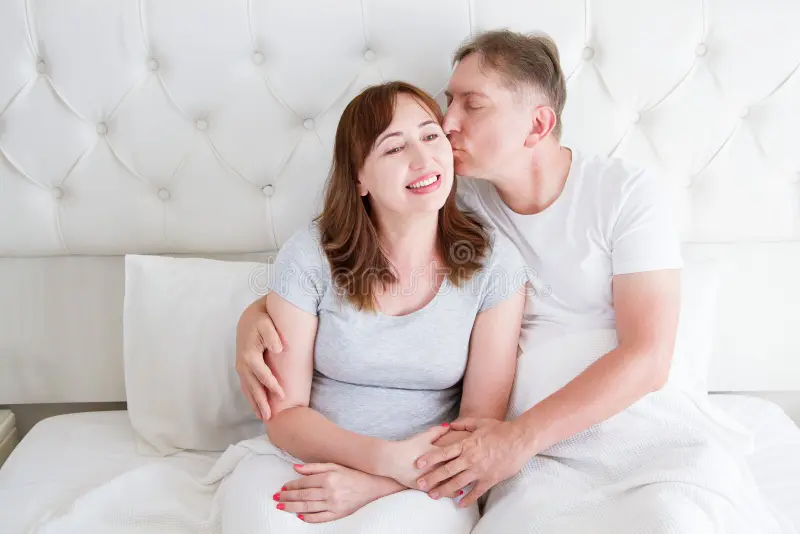 middle-age-family-couple-white-bedroom-bed-husband-kiss-wife-love-romance-healthy-relationship-middle-age-family-couple-128238644
